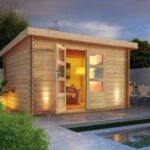 Modernes Blockbohlenhaus „Bastrup 7" Pultdach aus Holz in Natur